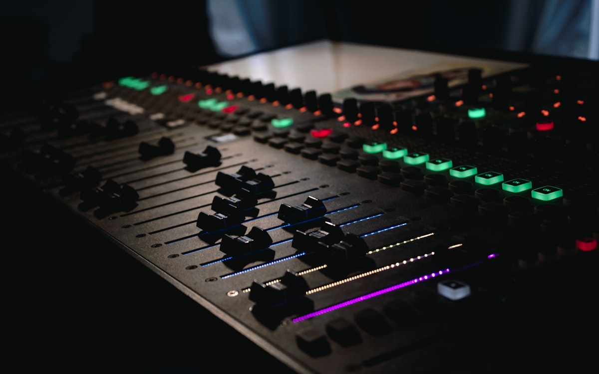 Close-up of FOH mixing console controls during a show